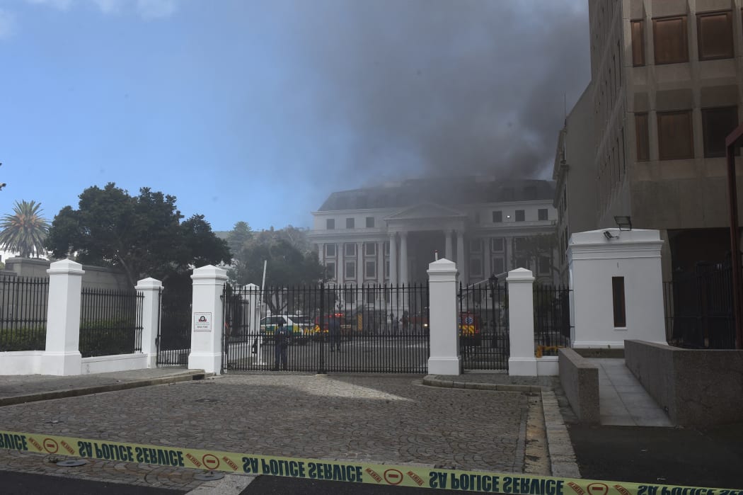 Firefighters are dispatched to extinguish a fire at the Parliament building in Cape Town, South Africa.