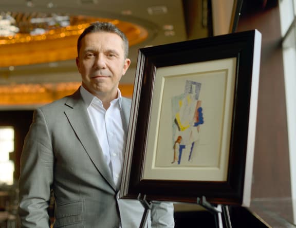 Olivier Picasso with his grandfather's painting.