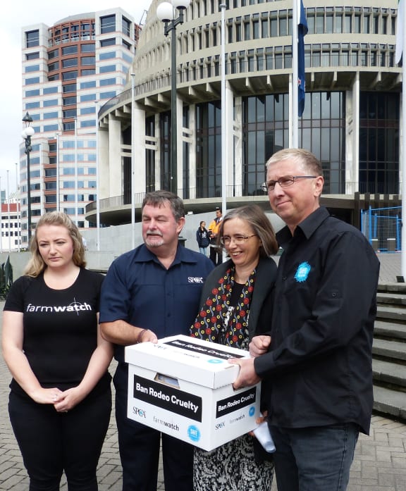 Jasmine Gray from Farmwatch, left, SPCA chief executive Ric Odom, Green Party MP Mojo Mathers and Hans Kriek from SAFE. Animal welfare advocates presented a petition to parliament asking them to ban rodeo.