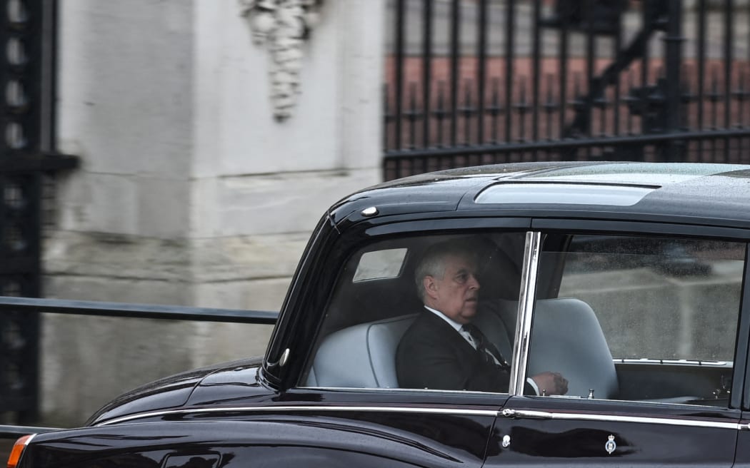 Prince Andrew, Duke of York travels from Buckingham Palace to Westminster Abbey in central London on May 6, 2023. - The set-piece coronation is the first in Britain in 70 years, and only the second in history to be televised. Charles will be the 40th reigning monarch to be crowned at the central London church since King William I in 1066. Outside the UK, he is also king of 14 other Commonwealth countries, including Australia, Canada and New Zealand. Camilla, his second wife, will be crowned queen alongside him and be known as Queen Camilla after the ceremony. (Photo by Oli SCARFF / AFP)