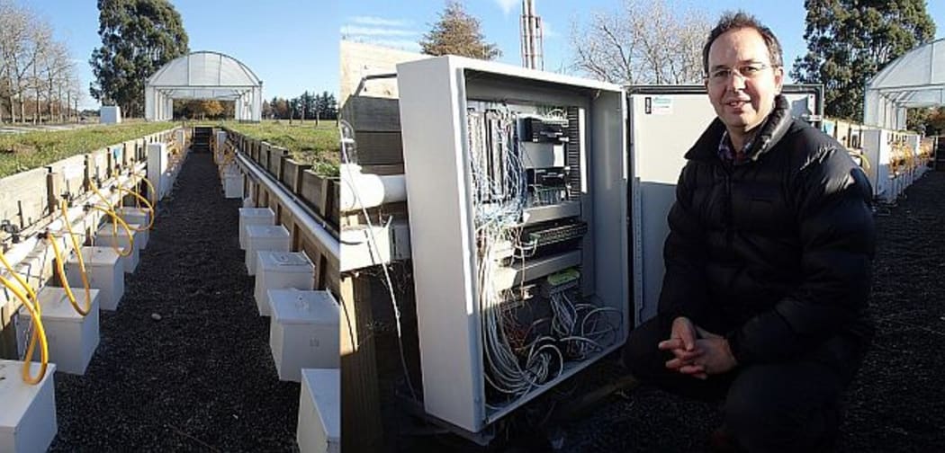 A lysimeter set-up with a travelling cover, and Sam Carrick with a complex computer control box with