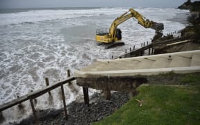 Surging tides eroded several metres of land in front of three Wainui properties last September.
