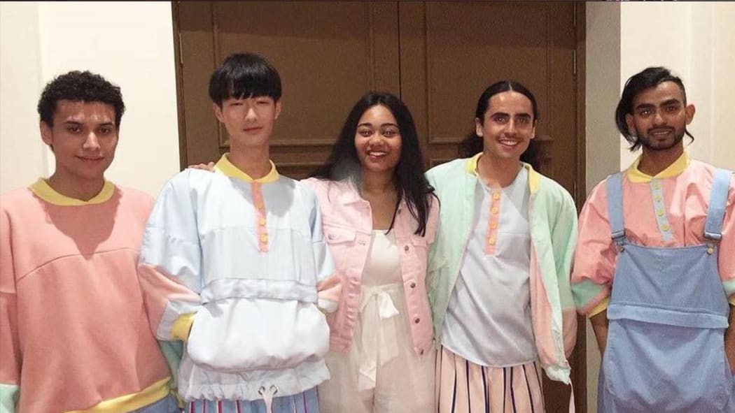 Ina Malama (centre) with models by her side displaying her Unfiltered Man collection.