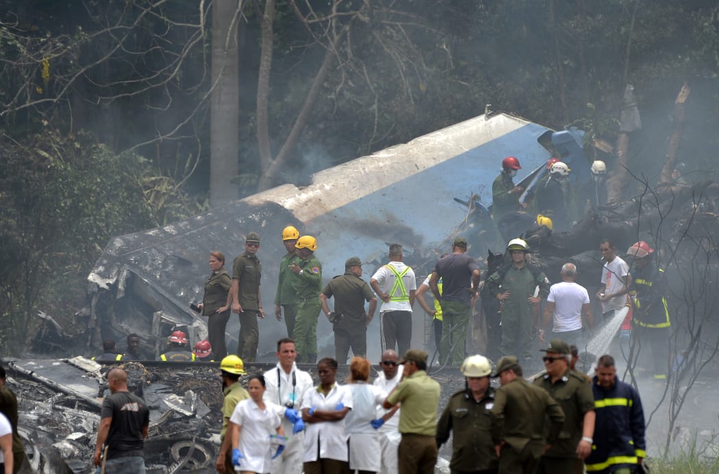 Emergency personnel work at the site of the accident after a Cubana de Aviacion aircraft crashed after taking off from Havana's Jose Marti airport.