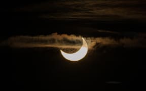 Cloud floats across the sun during the partial solar eclipse on Monday morning.