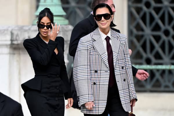US celebrity Kim Kardashian (L) leaves with her mother Kris Jenner (R) the Assize Court after testifying in a trial over the 2016 robbery that saw her relieved of millions of dollars' worth of jewellery at gunpoint in Paris, on May 13, 2025. The trial of this sensational nine million euro jewellery robbery opened in Paris on April 28, 2025. (Photo by LEO VIGNAL / AFP)