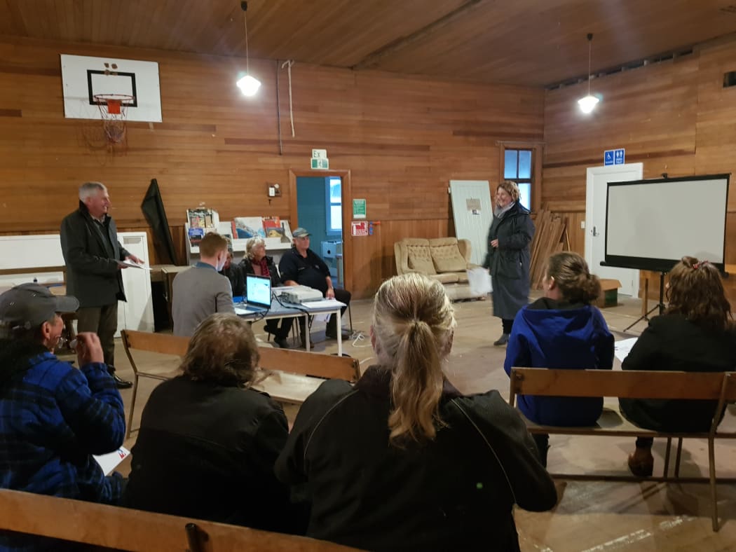 Buller mayor Jamie Cleine (standing, left) at a meeting of worried Inangahua Junction ratepayers this month.