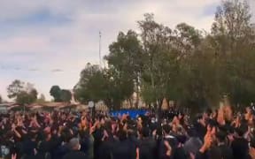 This grab taken from a UGC video made available on the ESN platform on 30 October 2022, reportedly shows Iranians gathered in Arak to mourn the death of a demonstrator who was allegedly beaten to death by security forces on 26 October.