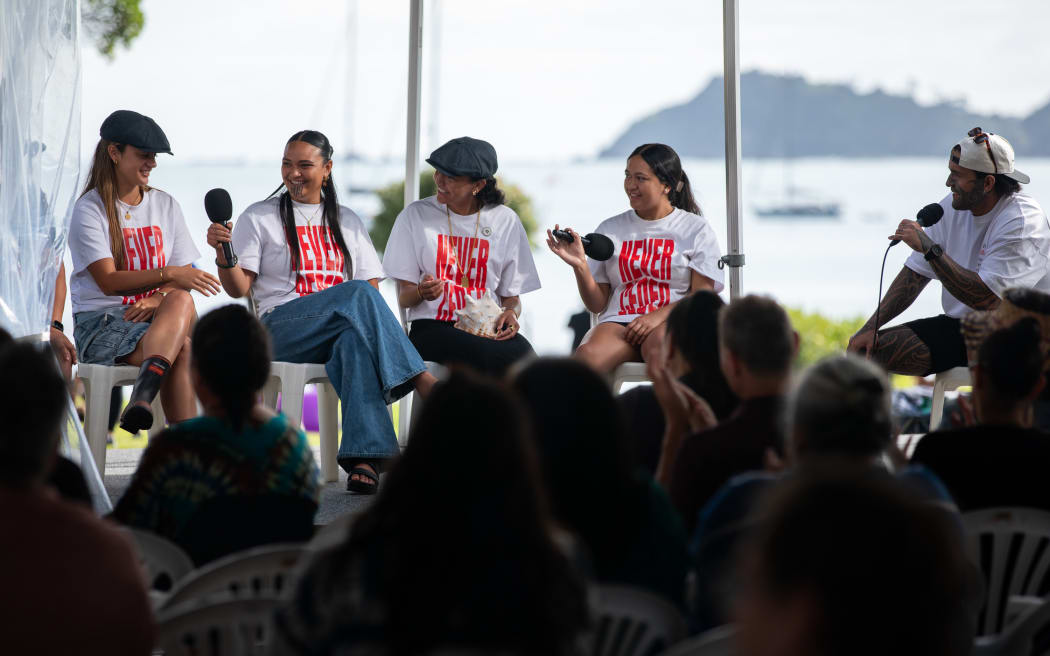 A group of rangatahi that were involved in Hīkoi mō te Tiriti speak at the Waitangi Forum Tent, February 2025.