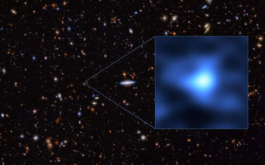 the precise location of the most distant known galaxy, called JADES-GS-z14-0, seen as an extremely tiny dot in the Fornax constellation.
Mandatory Credit:	Space Telescope Science Institute Office of Public Outreach via CNN Newsource