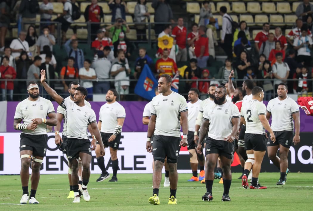 Fiji wave to the crowd after their final Rugby World Cup pool match against Wales.