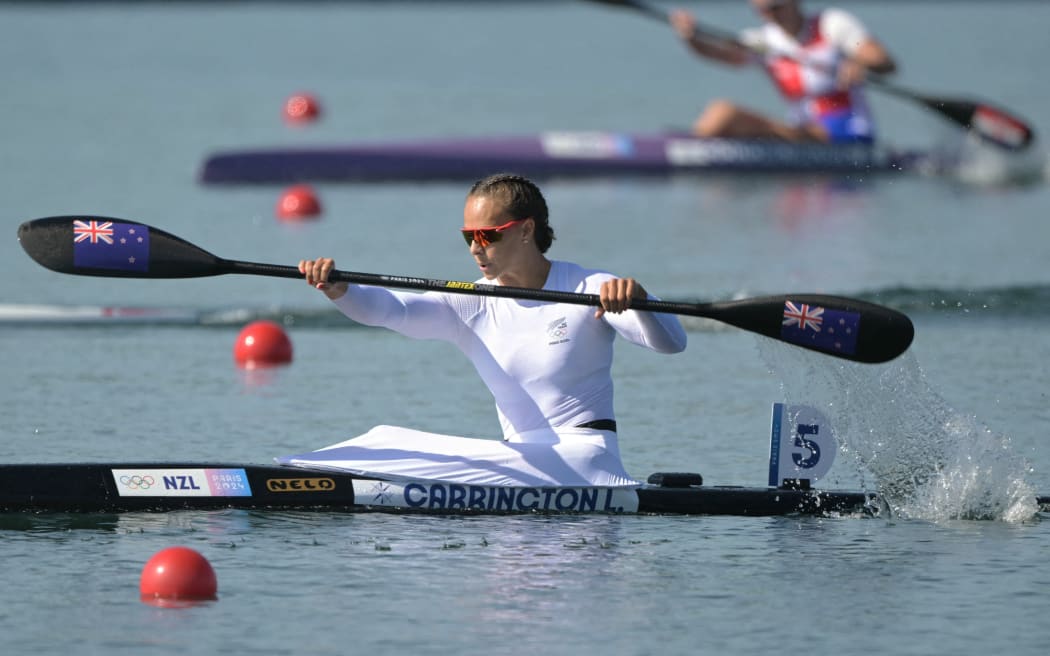 New Zealand's Lisa Carrington competes in the women's kayak single 500m semifinal of the canoe sprint competition at Vaires-sur-Marne Nautical Stadium in Vaires-sur-Marne during the Paris 2024 Olympic Games on August 10, 2024. (Photo by Bertrand GUAY / AFP)