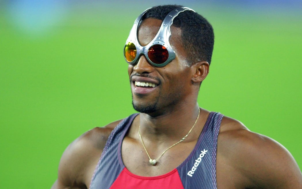 Ato Boldon of Trinidad and Tobago sports futuristic glasses at the men's Olympic 4x100m semifinals in Sydney 29 September 2000.