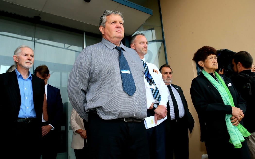 Kaipara Mayor Craig Jepson (centre grey shirt) and councillors meet the hikoi on the steps of the Northern Wairoa War Memorial Hall.