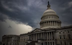 Storm clouds hang above the US Capitol Building.
