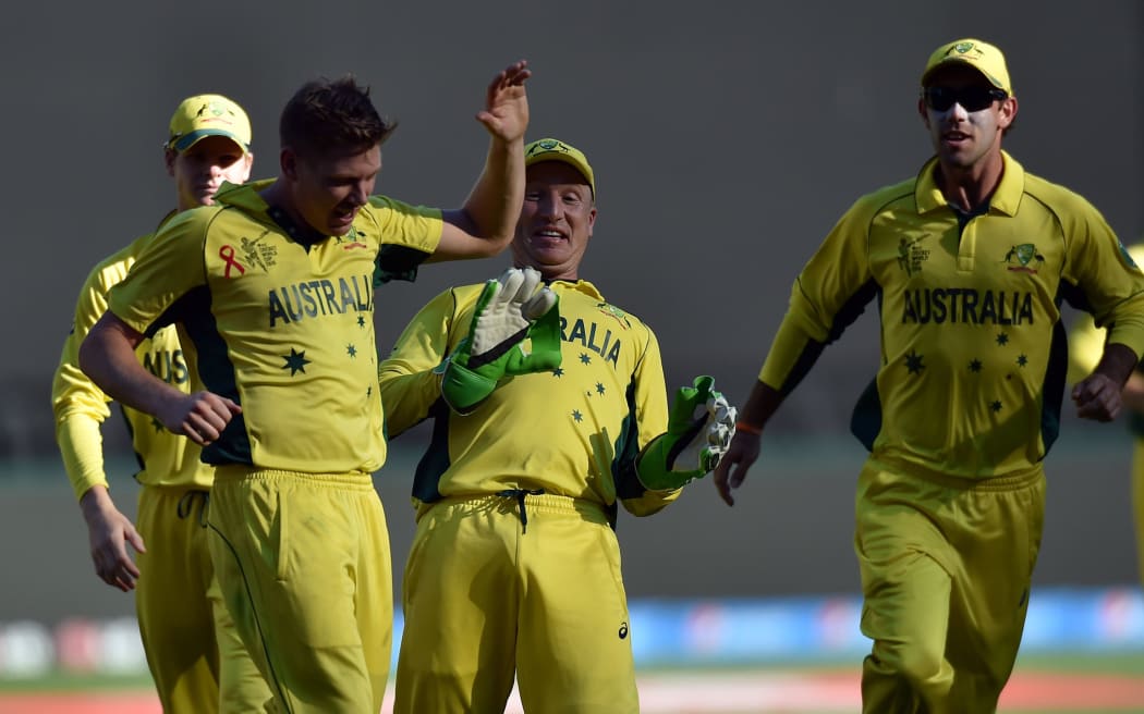 Australia's James Faulkner celebrates his wicket of New Zealand batsman Corey Anderson.