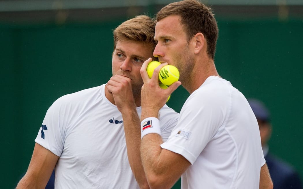 Michael Venus (right) and Ryan Harrison discuss tactics.