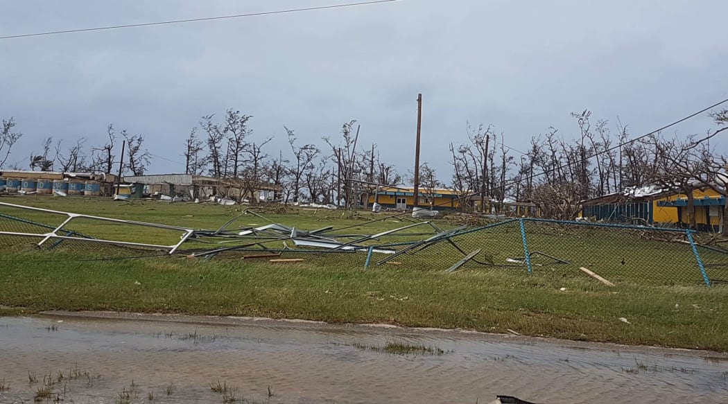 Debris litters the ground of a school in Saipan