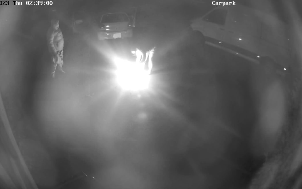 A CCTV image of the two people who arrived at the Matipo Lane premises in Palmerston North early on the morning of 30 November in a Toyota Echo with a covered number plate. Police are appealing for information about a suspicious fire at the location.