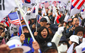 Supporters of South Korea's former President Park Geun-hye protest after a court sentenced Geun-hye to 24 years in prison.
