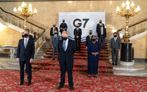 A handout picture released by the European Commission of family photograph with other delegates during the G7 foreign ministers meeting in London on May 5, 2021.