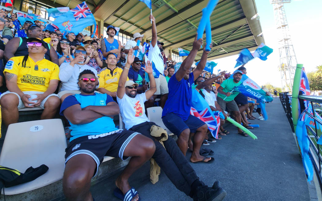 A young Hurricanes fan waves his flag in the crowd at McLean park in Napier on Saturday afternoon. Photo: Koroi Hawkins/RNZ