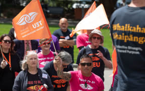 Members of the Tertiary Education Union protest outside Parliament