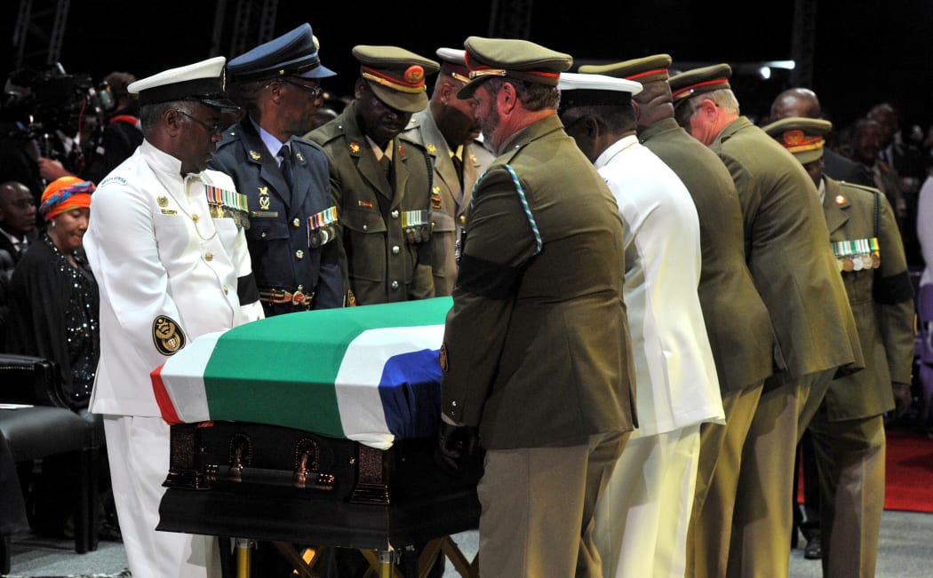 South Africa's first black president was laid to rest after a state funeral.