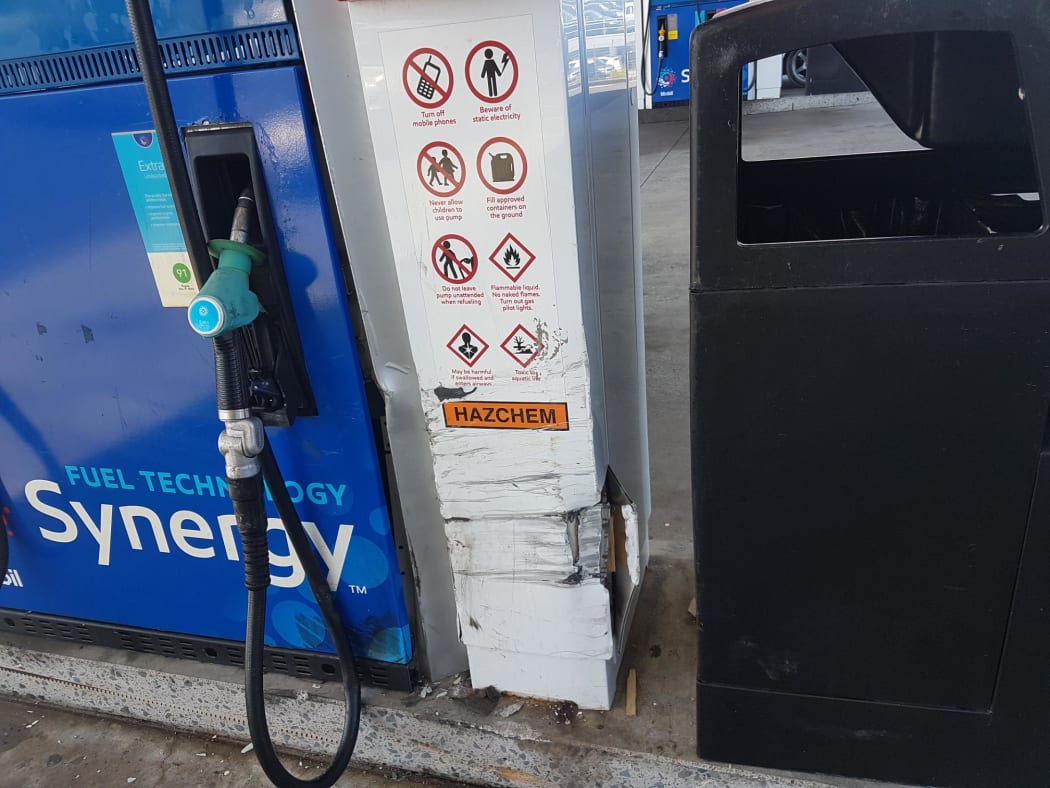 Scuff marks on the petrol pump at the petrol station.