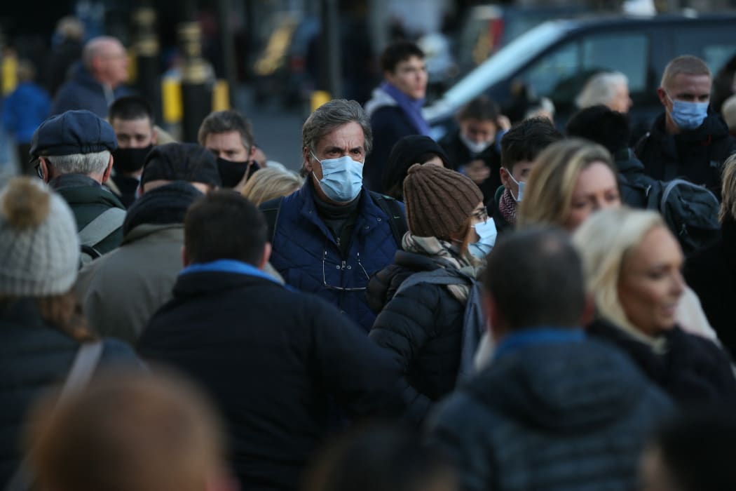 People wear face masks on streets after Omicron variant cases of Covid-19 rises to 160 in London, United Kingdom on December 04, 2021