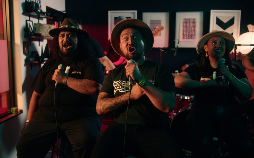 Te Whānau Mānihera perform in the band IllumiNgāti