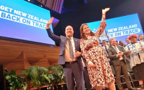 The National Party leaders wave to the faithful at the party's annual conference.