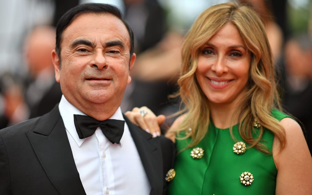 Renault CEO Carlos Ghosn (L) and his wife Carole Ghosn arrive on May 26, 2017 at the Cannes Film Festival in Cannes, southern France.