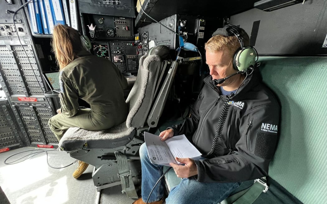 Prime Minister Chris Hipkins on the Hercules en route to Auckland to access the flood damage in the city.