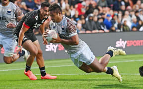 Alamanda Motuga scores a try for Moana Pasifika in last year's match vs the Māori All Blacks.