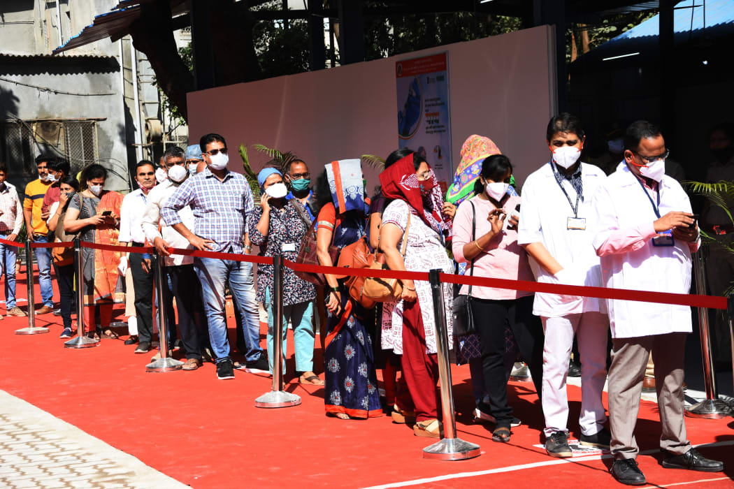 Indian Health workers wait in line to receive a Covid-19 coronavirus vaccine in Mumbai, India.