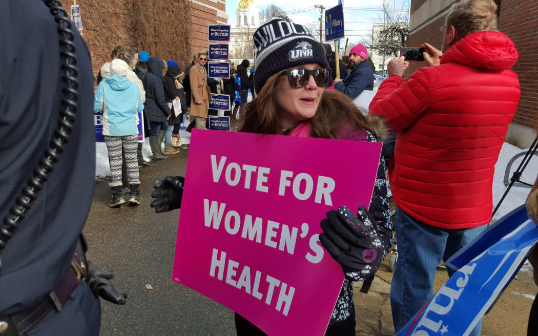Supporters of Hillary Clinton and Bernie Sanders at the Green Street Community Centre polling centre, Concord, during the New Hampshire primary.