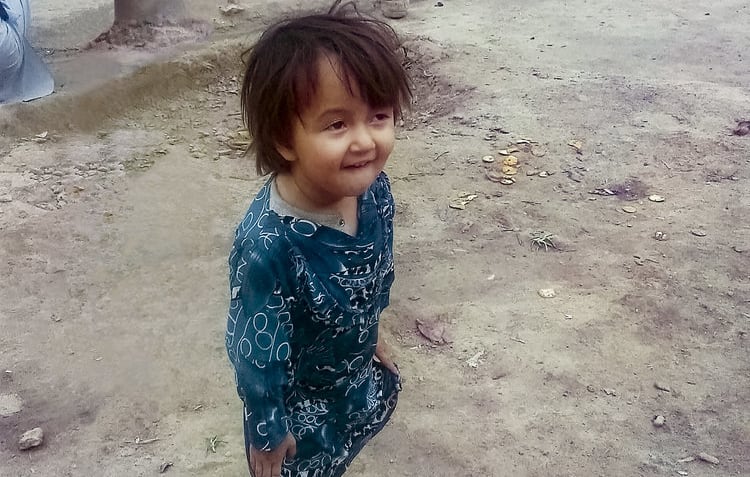 The book's authors provided this photo, which they say shows the three-year-old, Fatima, who was killed by shrapnel while being held in her mother's arms.