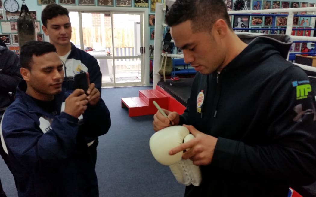 Joseph Parker signs autographs for fans at the Naenae Boxing Academy in Lower Hutt.