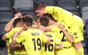 Phoenix players celebrate a Tomer Hemed goal.