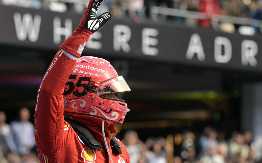 Ferrari's Spanish driver Carlos Sainz celebrates after winning the Mexico City Formula One Grand Prix.