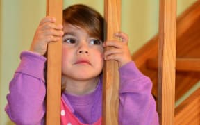 45835225 - sad girl looks at here fighting parents at home before bedtime.concept photo of child, childhood, family, problems, divorce ,abuse, violence.