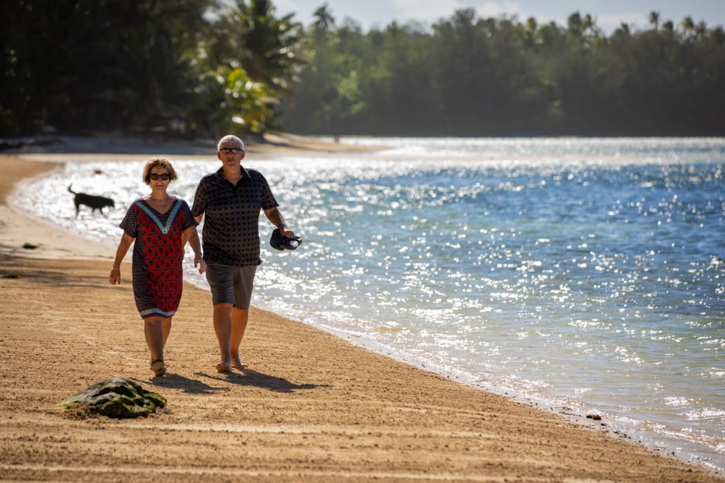 Tourists on Muri Beach, Rarotonga, Cook Islands.