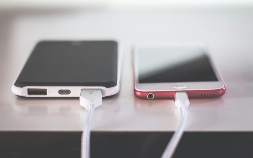 A phone on a charger.