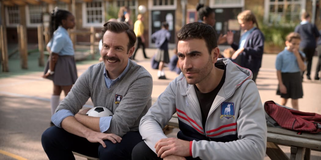 Jason Sudeikis (Ted Lasso) and Brett Goldstein (Roy) share a moment in Ted Lasso (Apple TV+)