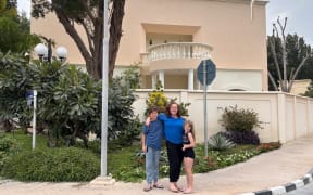 Kathryn Rush (centre) and her children Nick (11) and Emily (9) at their Doha home on Tuesday.