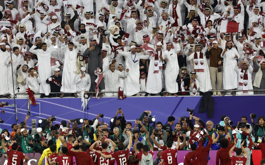 Qatar's players greet their fans at the end of the Qatar 2023 AFC Asian Cup semi-final win over Iran.