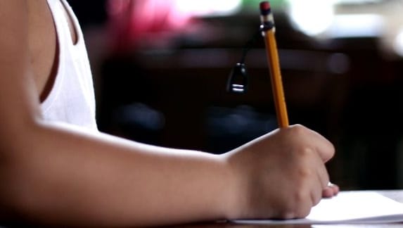 Child writing (file photograph).