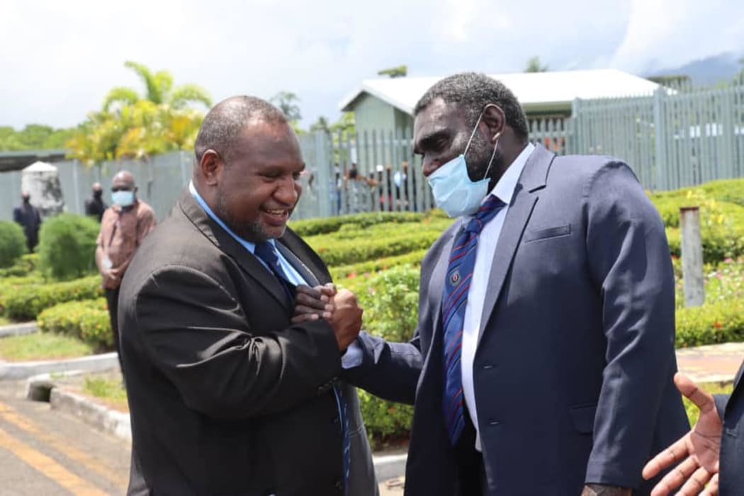 Papua New Guinea's Prime Minister James Marape (left) arrives in Arawa for talks hosted by Bougainville's President, Ishmael Toroama (right) 5 February, 2021.