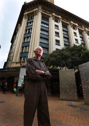 Owner Mark Dunajtschik in front of the Harcourts Building.